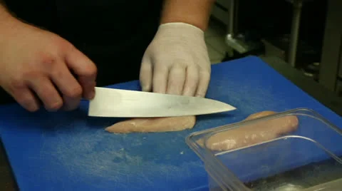 Slicing Raw Chicken Stock Footage 26960546