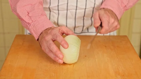 Slicing a Raw Onion Stock Footage 126655184