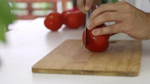 Slicing raw tomato Stock Footage 128589537