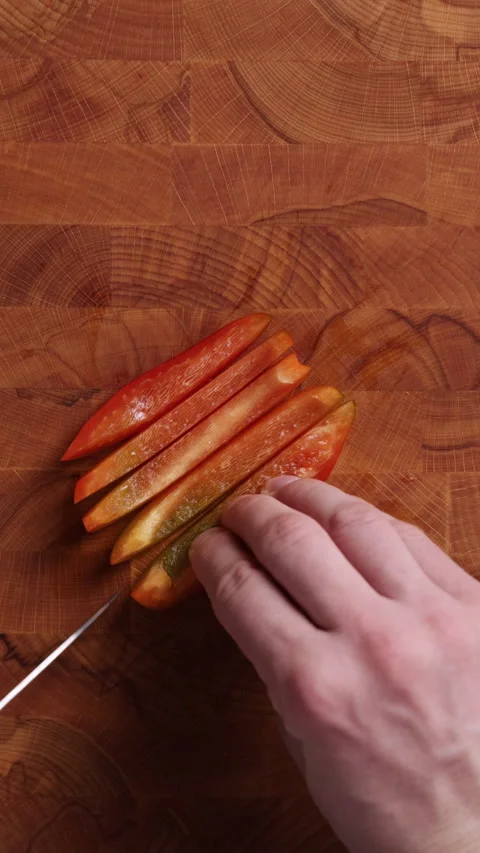Slicing Red Bell Pepper Close Up Vertical Top View Stock Footage 336574634
