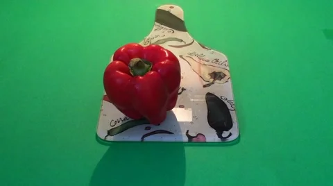Slicing a red bell pepper on a cutting board Video stock 42281326