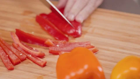 Slicing Red Bell Pepper into Strips Rack Focus Stock Footage 155114746