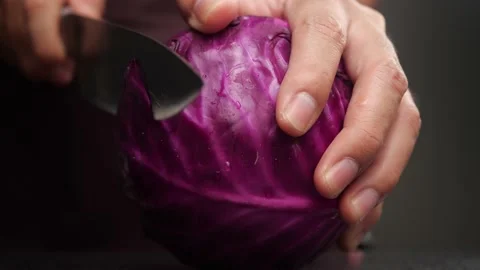 Slicing red cabbage in slow motion Stock Footage 134103217