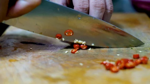 Slicing the red chili preparing ingredient for cooking in kitchen Stock Footage 100726503