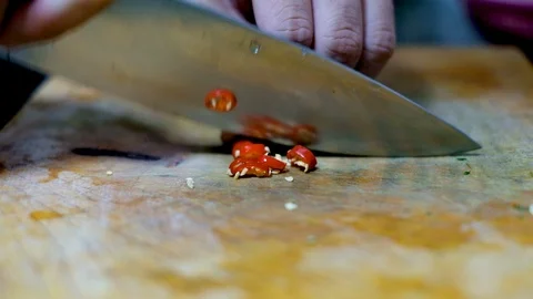 Slicing the red chili preparing ingredient for cook in kitchen Stock Footage 100737612