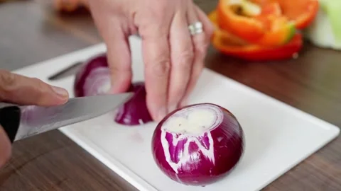 Slicing Red Onion Efficiently for Preparing Fresh and Delicious Vegetable Dishes Stock Footage 314619050