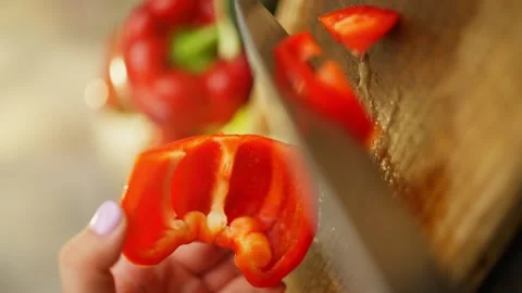 Slicing red pepper close-up. Preparation organic vegetable products for cooking. Stock Footage 296363108