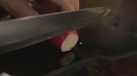Slicing a red radish Stock Footage 62598498