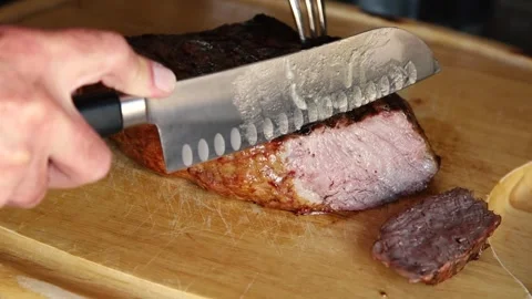 Slicing ribeye with knife Stock Footage 244967590
