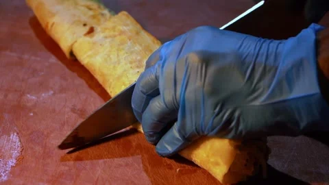 Slicing Rolled Food Stock Footage 319950036