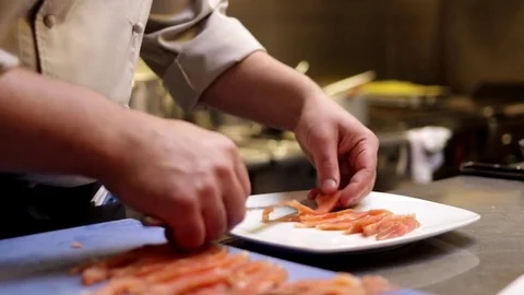 Slicing salmon in a professional kitchen Stock Footage 72977156