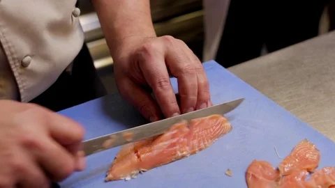 Slicing salmon in a professional kitchen Stock Footage 72977170