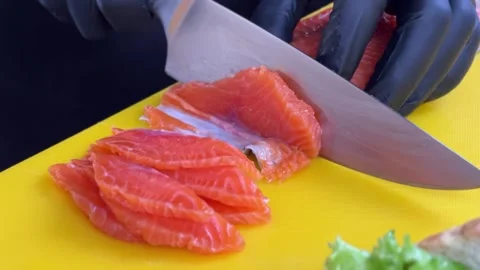 Slicing Salmon for Sashimi   Preparation Stock Footage 256972731