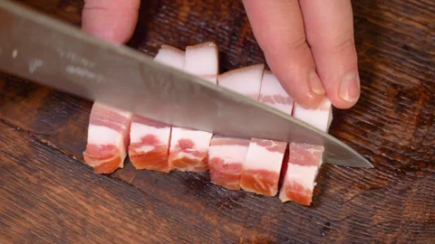 Slicing of salted pork fatback on cutting board, close-up. Stock Footage 254082012