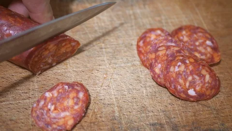 Slicing sausage. sharp salami Stock Footage 121087358