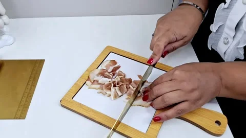 Slicing smoked bacon on board 스톡 동영상 332421886