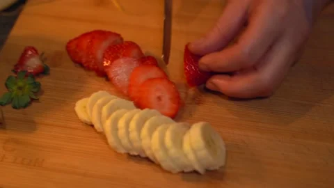 Slicing strawberry Stock Footage