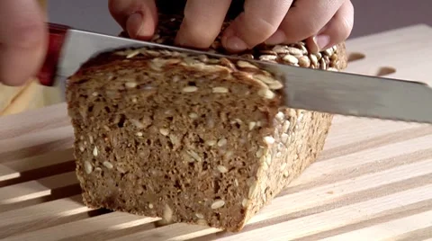 Slicing sunflower seed bread Video stock 8573705