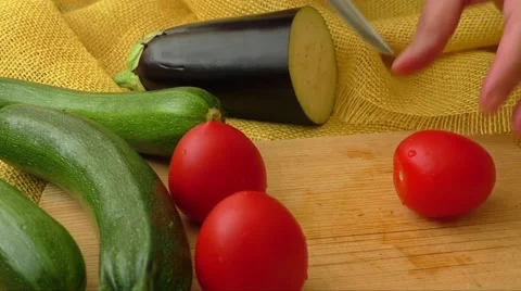 Slicing tomato on chopping board Stock Footage 63312667