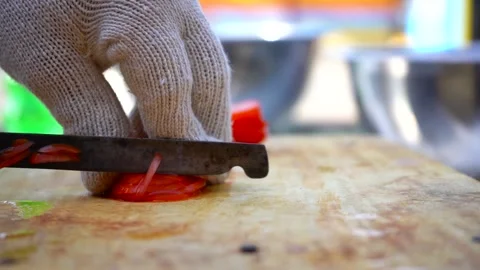 Slicing tomato on chopping board Stock Footage