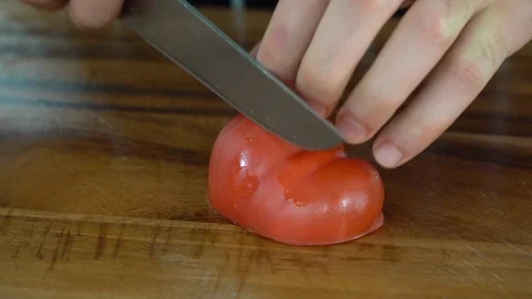 Slicing tomato on a cutting board, close up, making cubes, ib01 Stock Footage 109128006