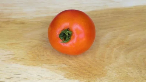 Slicing tomato on cutting board Stock Footage 78533194