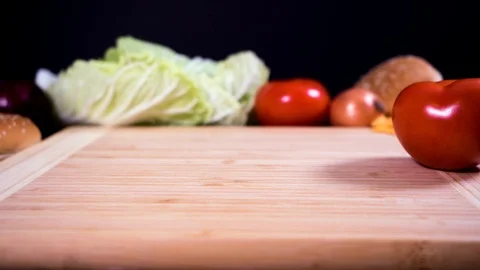 Slicing a tomato on a cutting board. Stock Footage 123159681