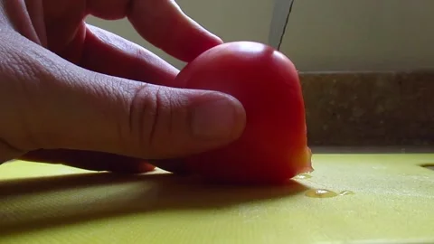 Slicing a Tomato Video stock 254654919