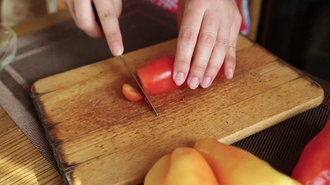 Slicing tomato in the kitchen Stock-Footage 77571711