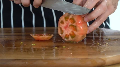 Slicing tomato in the kitchen, ib01 Stock Footage 109123190