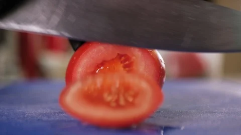 Slicing the Tomato with Kitchen Knife Stock Footage 108685069