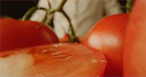 Slicing tomato macro shot Stockbeeldmateriaal 126295520