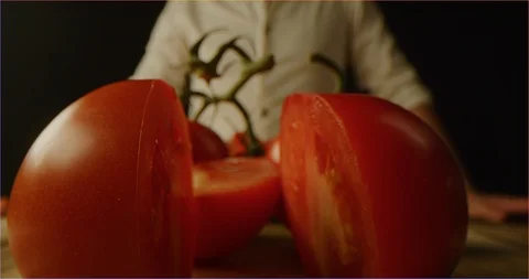 Slicing tomato macro shot Stock Footage 126295580