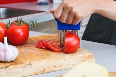 Slicing tomato Stock Photos