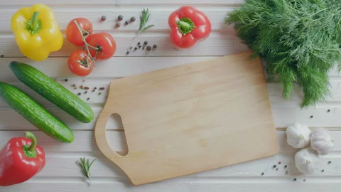 Slicing tomato for a salad, vegetarian flat lay Stock Footage 86042018
