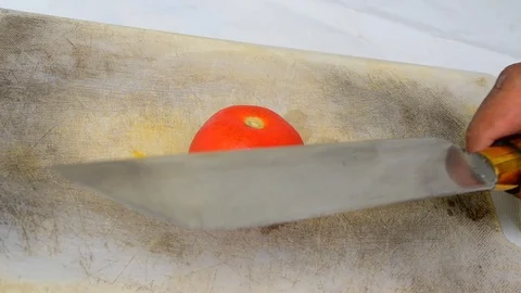 Slicing tomato using very sharp knife Stock Footage 119741677