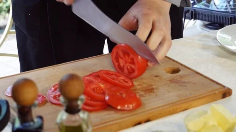 Slicing tomatoes for cooking Stock-Footage 105398821