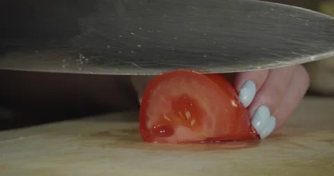 Slicing tomatoes with a knife Stock Footage 132117120