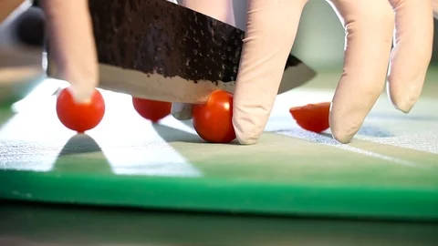 Slicing tomatoes for a meal. Stock Footage 99438228