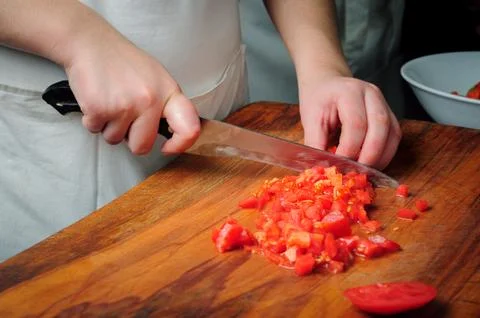 Slicing tomatoes Stock Photos
