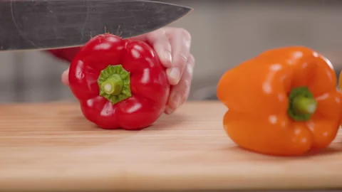 Slicing the Top of a Red Bell Pepper Close Up Stock Footage 155115122