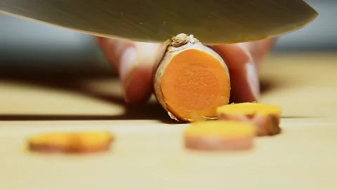Slicing turmeric roots. Stock Footage 142828406
