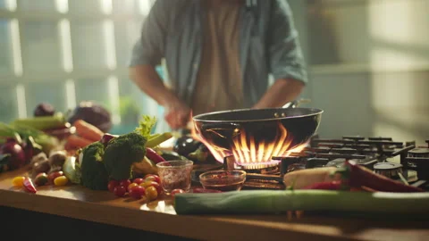 Slicing vegetables and putting in pan Stock Footage 311835136