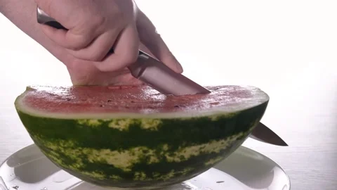 Slicing watermelon with a knife. Stock Footage 204947968