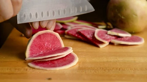 Slicing Watermelon Radish Into Half Moons On Cutting Board Stock Footage 116787386