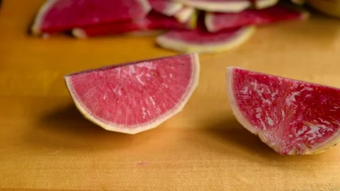 Slicing Watermelon radish into Half Moons Stock Footage 116787396