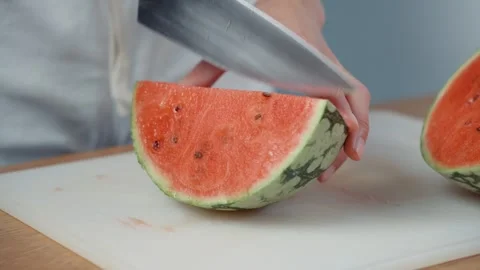 Slicing Watermelon into Wedges with Kitchen Knife Stock Footage 343937898