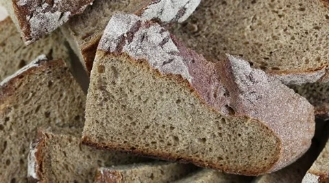 Slicing whole grain bread rotate. Close up Stock Footage 66978888