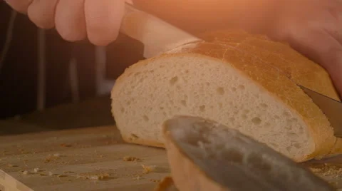 Slicing Wholegrain Bread in slow motion Stock Footage 62841857
