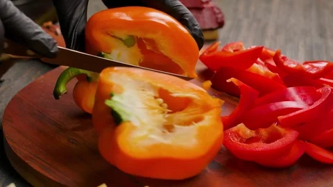 Slicing yellow bell pepper Stock Footage 334338490